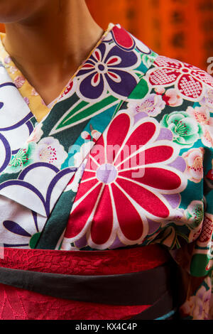 Traditional japanese female clothing at Fushimi Inari shrine in Kyoto, Japan Stock Photo