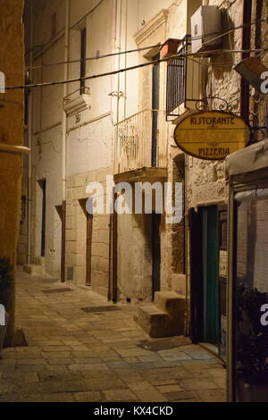 View of an empty alley at night inside the old city of Polignano a Mare, Apulia - Italy Stock Photo