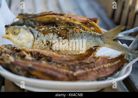 Deep fried whole Bangus cooked Filipino style,crispy & crunchy. Stock Photo