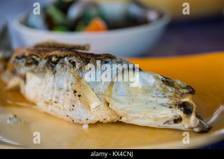 Deep fried whole Bangus cooked Filipino style,crispy & crunchy. Stock Photo