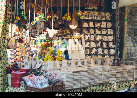 Krakow, Poland - December 30, 2017: Kiosk selling hand crafted wooden toys and souvenirs at a Christmas market in Krakow. Stock Photo