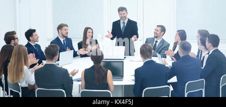 friendly business team applause greeted his boss before the busi Stock Photo