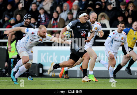 Newcastle Falcons Josh Matavesi makes a break as Exeter Chiefs Matt Kvesic challenges during the Aviva Premiership match at Kingston Park, Newcastle. Stock Photo