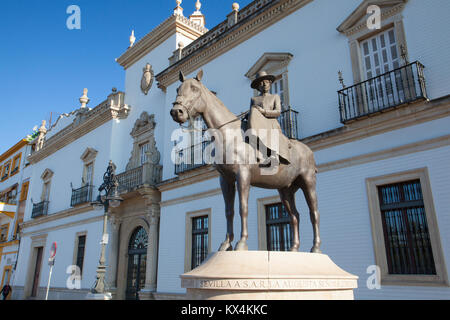 Seville, Spain - November 19,2016: Bullfight arena.View of the facade of Real Maestranza de Caballeria and the monument to the mother of King Juan Car Stock Photo