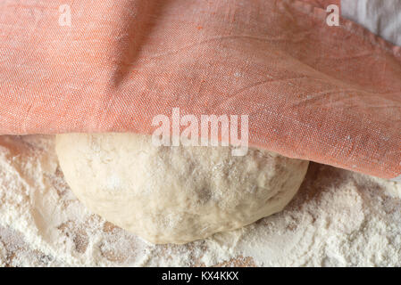 fresh raw dough ball on wooden table Stock Photo