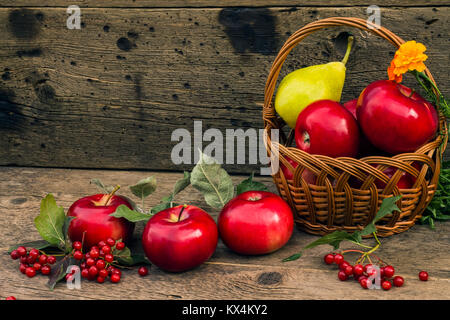 red apples and pears in the basket Stock Photo