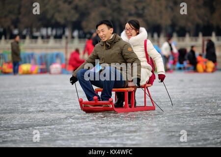 Beijing, China. 7th Jan, 2018. Tourists have fun in the ice rink at the Summer Palace in Beijing, capital of China, Jan. 7, 2018. During the weekend, many people came to the ice rink on Kunming Lake to relax or take exercise. Credit: Liu Xianguo/Xinhua/Alamy Live News Stock Photo
