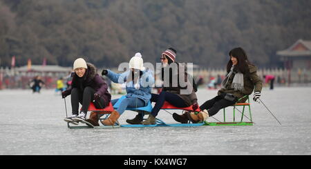 Beijing, China. 7th Jan, 2018. Tourists have fun in the ice rink at the Summer Palace in Beijing, capital of China, Jan. 7, 2018. During the weekend, many people came to the ice rink on Kunming Lake to relax or take exercise. Credit: Liu Xianguo/Xinhua/Alamy Live News Stock Photo