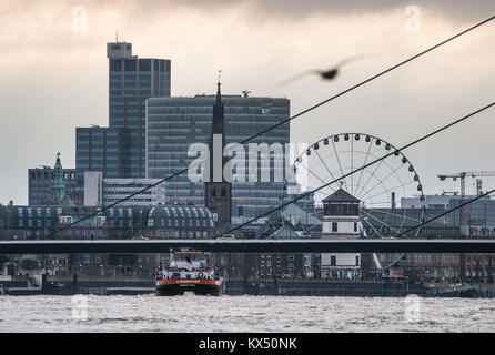 Duesseldorf, Germany. 7th Jan, 2018. A container ship on the river Rhine during high water levels in Duesseldorf, Germany, 7 January 2018. Credit: Bernd Thissen/dpa/Alamy Live News Stock Photo