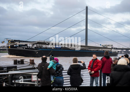 Duesseldorf, Germany. 7th Jan, 2018. A large ship moves up the river Rhine during high water levels in Duesseldorf, Germany, 7 January 2018. Credit: Bernd Thissen/dpa/Alamy Live News Stock Photo