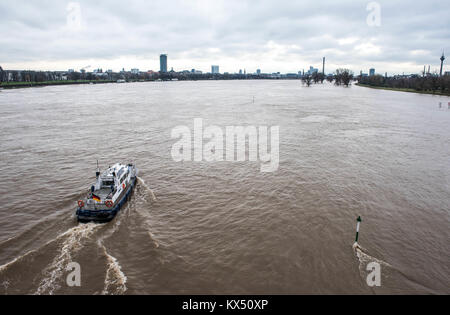 Duesseldorf, Germany. 7th Jan, 2018. A water police boat on the river Rhine during high water levels in Duesseldorf, Germany, 7 January 2018. Credit: Bernd Thissen/dpa/Alamy Live News Stock Photo