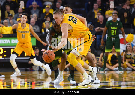 Wichita, Kansas, USA. 07th Jan, 2018. Wichita State Shockers center Rauno Nurger (20) steals the ball from South Florida Bulls guard Terrence Samuel (2) in the first half during the NCAA Basketball Game between the USF Bulls and the Wichita State Shockers at Charles Koch Arena in Wichita, Kansas. Kendall Shaw/CSM/Alamy Live News Stock Photo