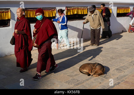 Tibetan pilgrim and monks making the Kora around Boudhanath Stupa, Kathmandu, Nepal Stock Photo