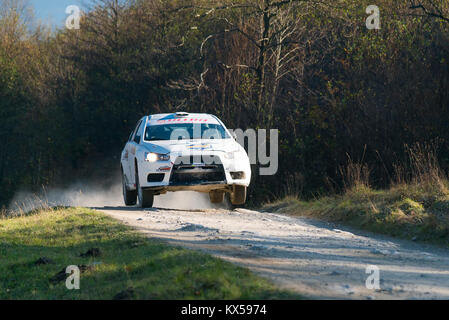 Lviv, Ukraine - November 1, 2015: Racers Alexey Dolot and Anatoliy Nadvetski on the car brand Mitsubishi Lancer Evo X  (No.10) overcome the track at t Stock Photo