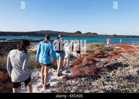 People walking on Chinese Hat  Island as part of a guided tour, Galapagos National Park, Galapagos Islands Ecuador South America Stock Photo