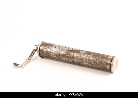 vintage brass coffee grinder over a white background Stock Photo