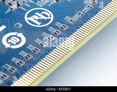 extreme close up of computer part with microcircuits in blue color and lead free symbol in focus stack technique Stock Photo
