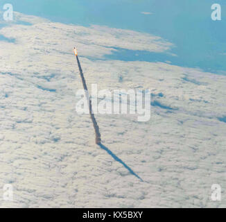 Space Shuttle Endeavour (STS-134) blasts through the cloud deck after launching from Kennedy Space Center Launch Complex 39 on Merritt Island in Florida, United States on 16 May 2011 to delivering equipment to the International Space Station (ISS). See image KX5BY6 for version with an inset showing the shuttle closer. Stock Photo