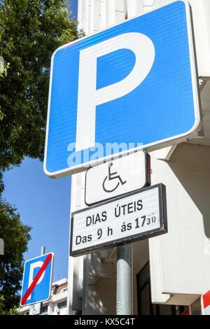 Lisbon Portugal,Rua Alexandre Herculano,Marques de Pombal,street sign,disabled handicapped special needs parking,Hispanic,immigrant immigrants,Portugu Stock Photo