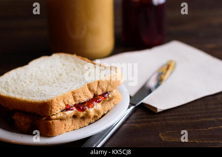 Peanut butter and jelly sandwich on wooden background Stock Photo