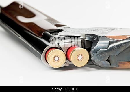 Red 12 guage shells loaded into a classic shotgun Stock Photo