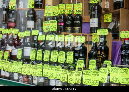 Porto Portugal,historical history center,Garrafeira Cleriporto,liquor store,vintner,Port wines,window display,price,Euros,bottles,Hispanic Latin Latin Stock Photo