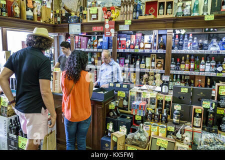 Porto Portugal,historical center,Garrafeira Cleriporto,liquor store,vintner,Port wines,display,price,Euros,bottles,Hispanic man men male,woman female Stock Photo