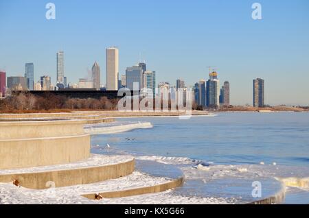 Winds, bitter cold with wind chill factors exceeding minus 20 degrees created vapor in front of the city skyline. Chicago, Illinois, USA. Stock Photo