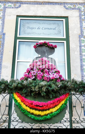 Lisbon Portugal,Rossio,historic center,Praca da Figueira,storefront,carnival costumes,flowers,garlands,Hispanic,immigrant immigrants,Portuguese,PT1707 Stock Photo