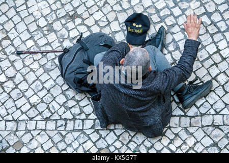 Lisbon Portugal,historic center,Praca dos Restauradores,plaza,Hispanic,immigrant immigrants,man men male,senior seniors citizen citizens,walking cane, Stock Photo