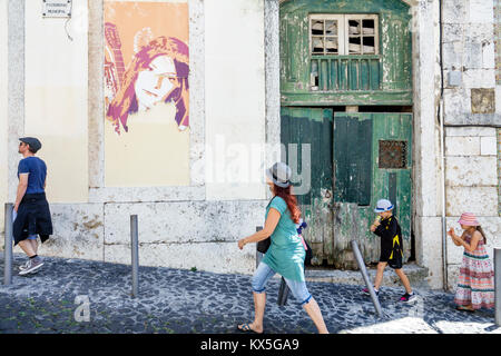 Lisbon Portugal,Castelo quarter,Costa do Castelo,inclined,uphill,sidewalk,Hispanic Latin Latino ethnic minority,immigrant immigrants,family families p Stock Photo