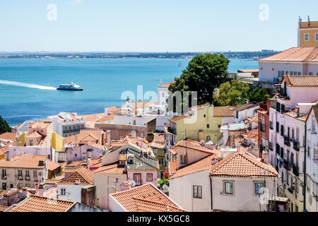 Lisbon Portugal,Tagus River water,Alfama,historic neighborhood,view from Miradouro das Portas do Sol,observation deck,terrace,viewpoint,skyline,roofto Stock Photo