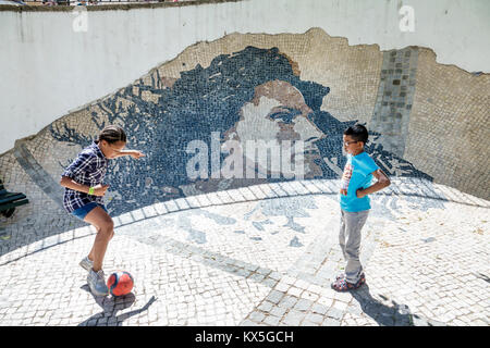 Lisbon Portugal,Alfama,historic neighborhood,Wall Of Amalia Rodrigues,tile mural,singer,fado,Black minorities,mixed race,girl girls,female kid kids ch Stock Photo