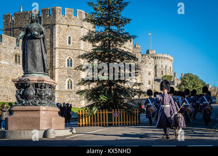 Irish Guards march out past the Christmas Tree after Changing of The Guard at Windsor Castle Stock Photo