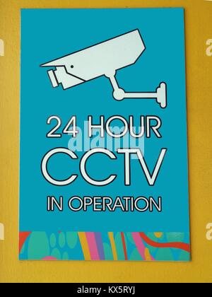 A sign warning that CCTV cameras are in operation 24 hours a day in this location Stock Photo