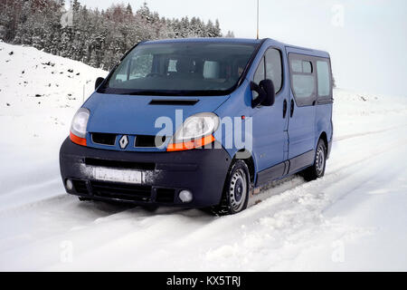 Blue Renault Trafic in Snow (full screen) Stock Photo