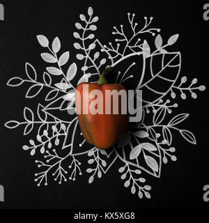 Red bell pepper over outline floral hand drawn background Stock Photo