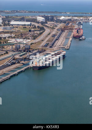 Coal ships being loaded at Kooragang Island in Newcastle - New South Wales Australia. Newcastle is one of the largest coal export ports in the world e Stock Photo