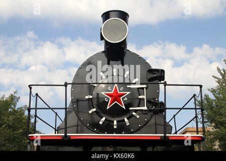 Old soviet locomotive near Stalingradskaya panorama in Volgograd, Russia Stock Photo