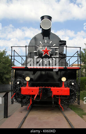 Old soviet locomotive near Stalingradskaya panorama in Volgograd, Russia Stock Photo