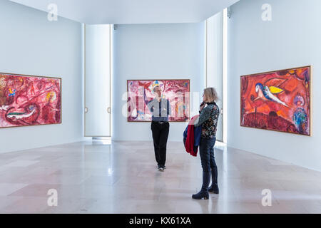 People look at Marc Chagall bible series oil paintings including 'Song of Songs iV' Musée National Marc Chagall, Nice, France, Stock Photo