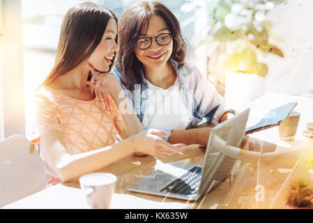 Positive nice women discussing their ideas Stock Photo
