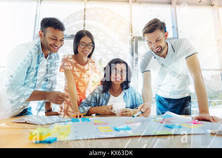 Positive creative team discussing their project Stock Photo