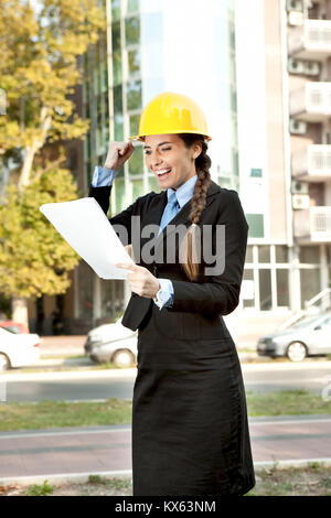 happiness  female architect, looking in document with good news Stock Photo