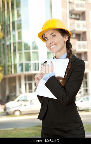 smiling female engineer with her project in background Stock Photo