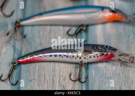 Fishing lures on a wooden background Stock Photo - Alamy