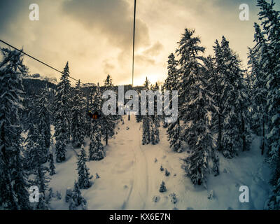 Picture from a chairlift on Mount Faloria after a snowfall at sunset, Cortina D'Ampezzo, Italy Stock Photo