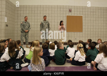 Major Gen. Jeff Burton and Command Sgt. Maj. Michael Miller thank the three kindergarten classes at St. John The Baptist Catholic Schools for their donation to the Utah Guard Charitable Trust. Stock Photo