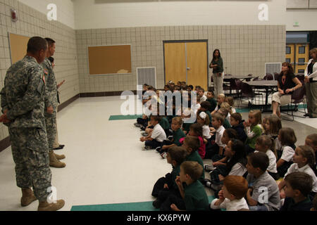 Major Gen. Jeff Burton and Command Sgt. Maj. Michael Miller thank the three kindergarten classes at St. John The Baptist Catholic Schools for their donation to the Utah Guard Charitable Trust. Stock Photo