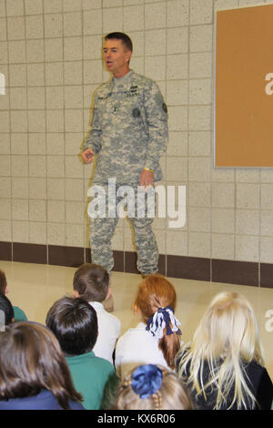 Major Gen. Jeff Burton and Command Sgt. Maj. Michael Miller thank the three kindergarten classes at St. John The Baptist Catholic Schools for their donation to the Utah Guard Charitable Trust. Stock Photo